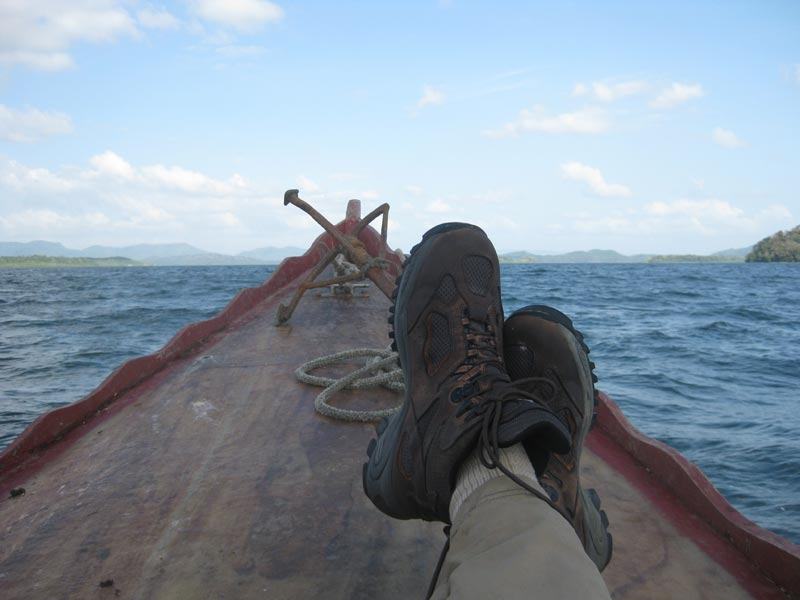 Perhaps my favorite photo of all time. I am very happy, I found the village and the sawmill site. I have lots of artifacts from the mill. I have nothing to do and no where to go. No flight. and 10 weeks left on my visa. What to do. I propped my boots on the boat leaned back and let the ocean breeze dry the sweat.